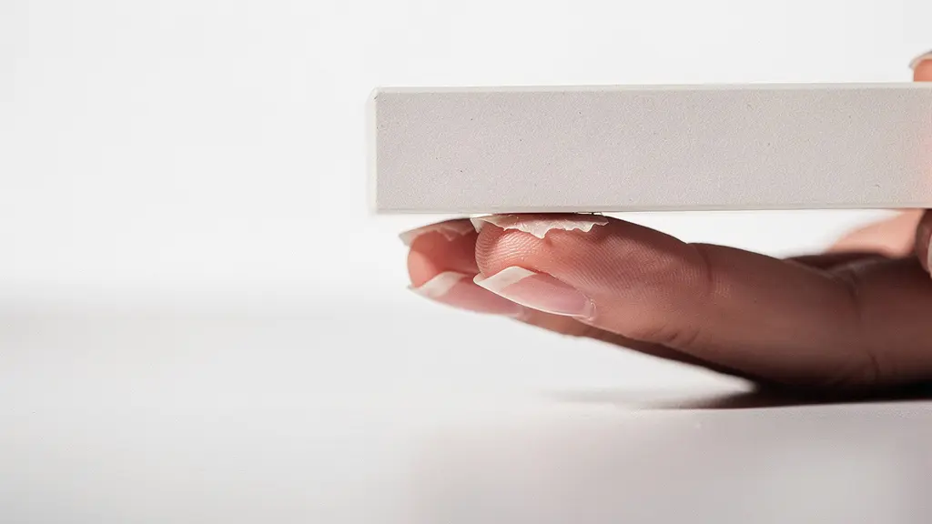 Cross-section visualization of nail ridge buffing showing peak-only technique